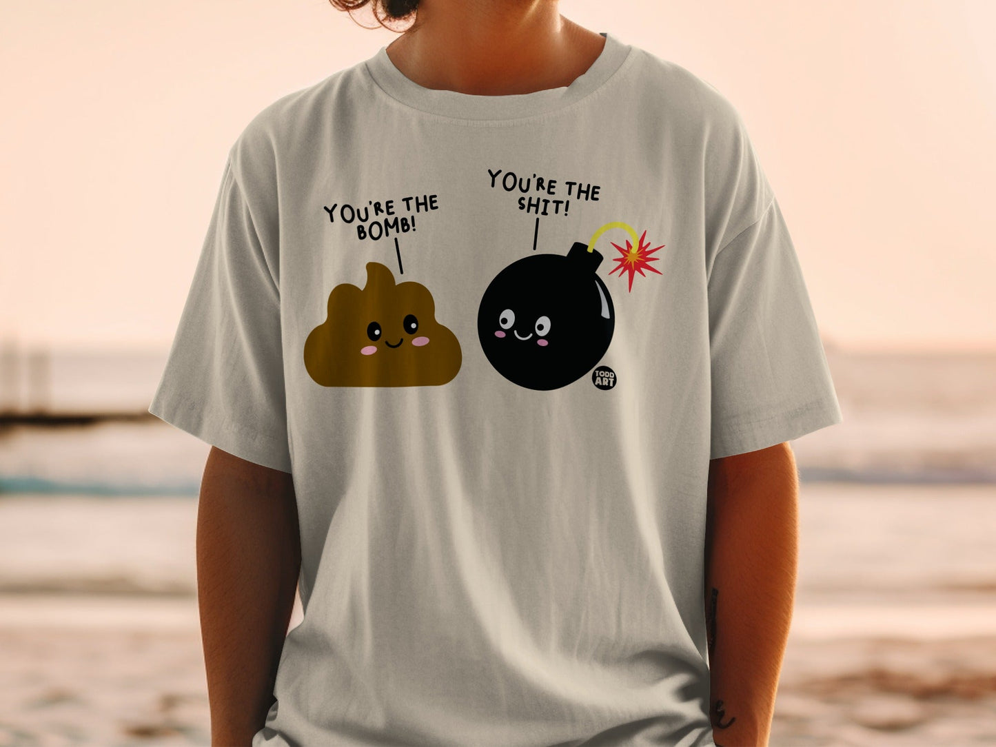 T-shirt with cartoon poop and bomb saying "You're the bomb!" and "You're the shit!".
