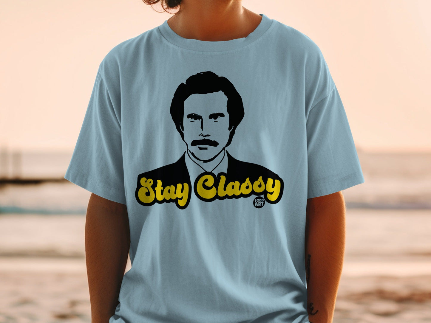 Light blue t-shirt with Will Ferrell's Ron Burgundy saying "Stay Classy".