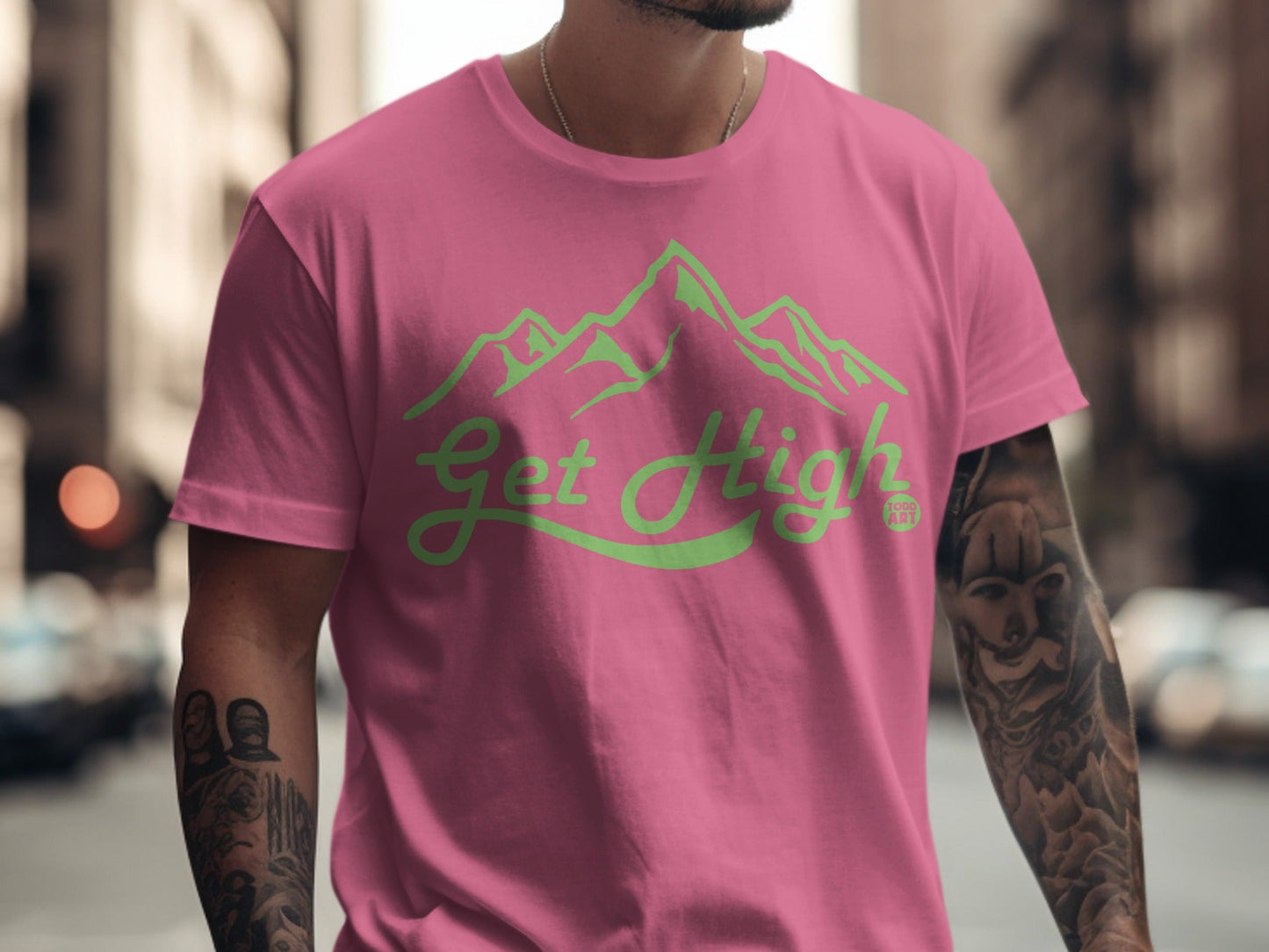 Pink t-shirt with neon green "Get High" text and mountain graphic.