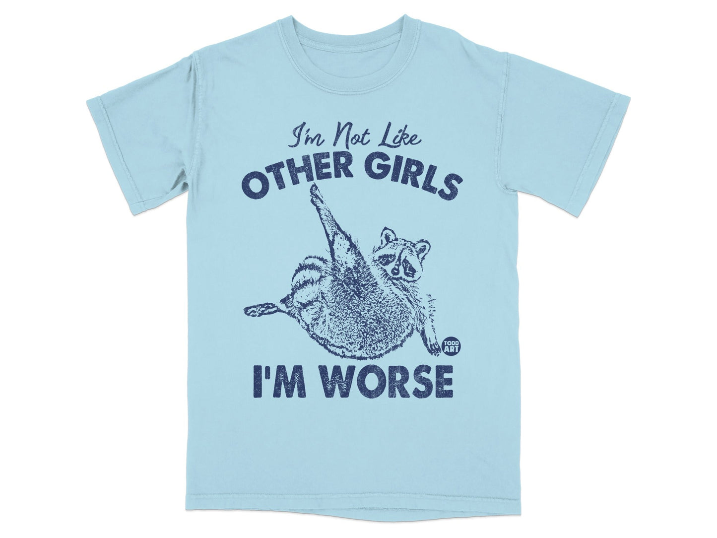 Light blue t-shirt with raccoon graphic and text "I'm Not Like Other Girls I'm Worse".