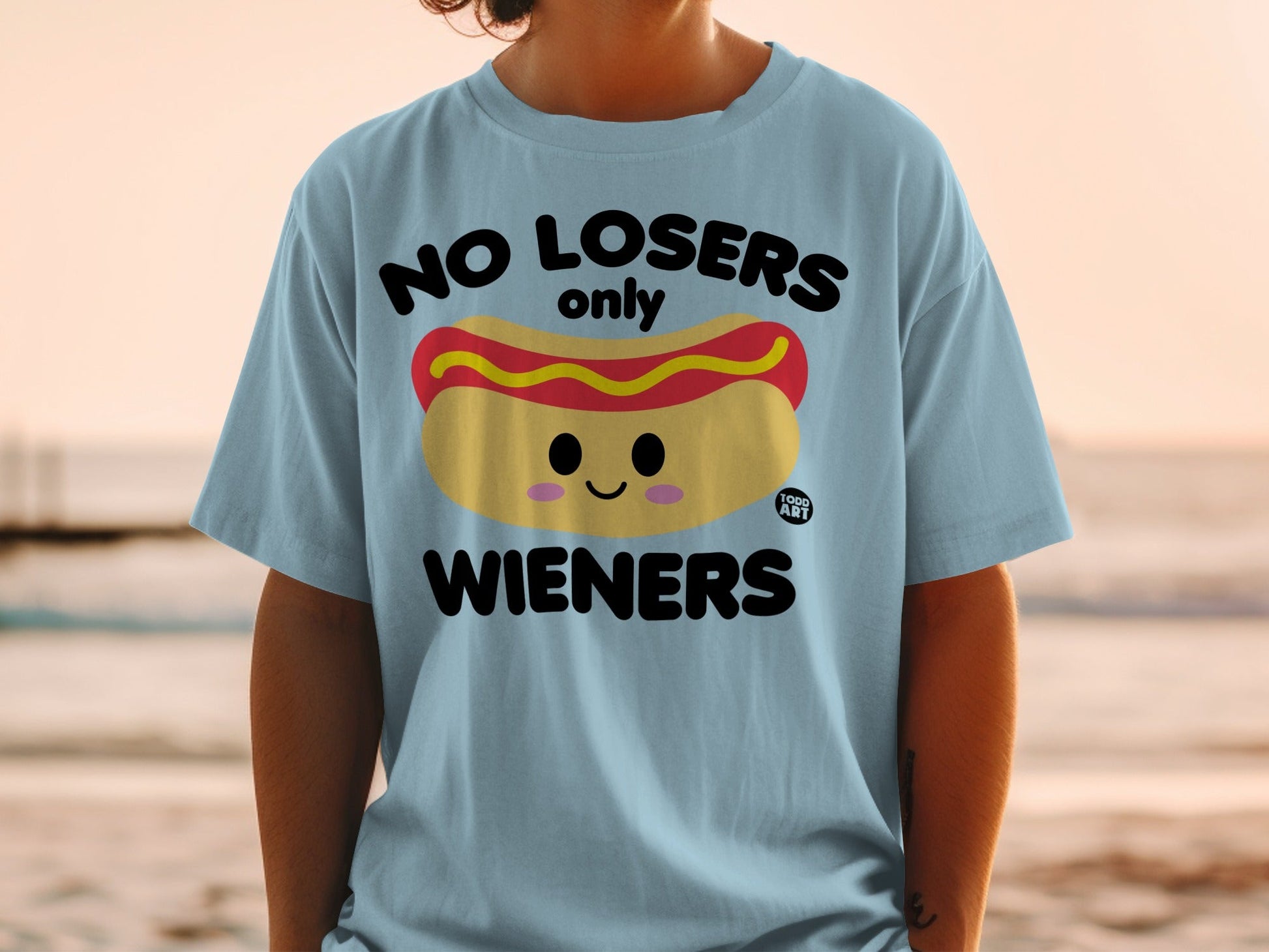 Light blue t-shirt with "NO LOSERS only WIENERS" and a cartoon hot dog graphic.
