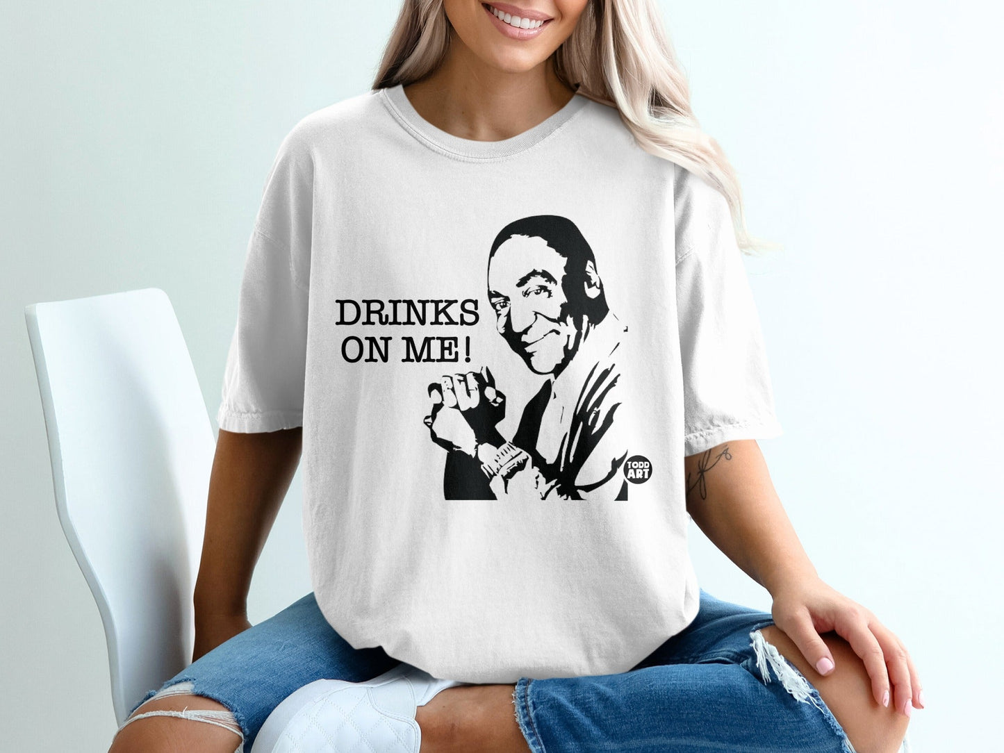 T-shirt with illustration of man and text "DRINKS ON ME!".